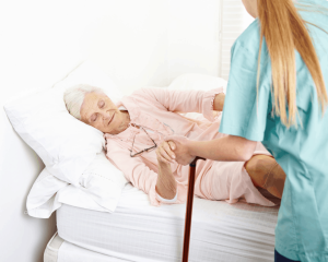 Elderly helped by a caregiver