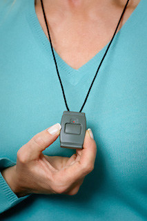 Woman wearing an emergency button